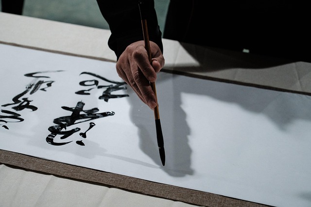 A calligrapher writing Chinese characters with his brush
