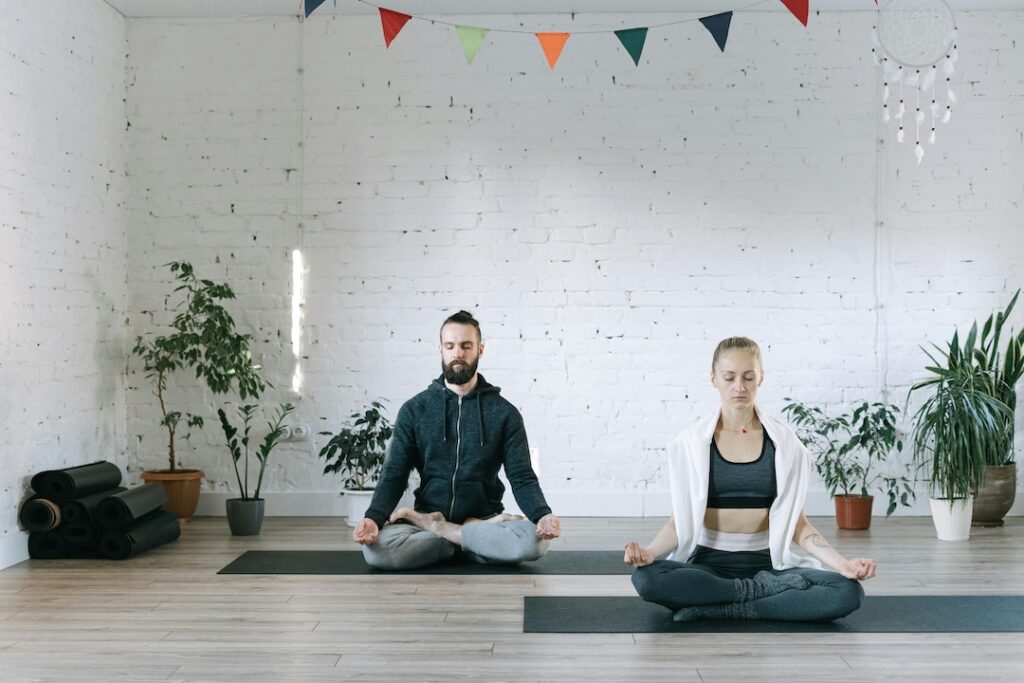 Two people sitting in quiescent meditation